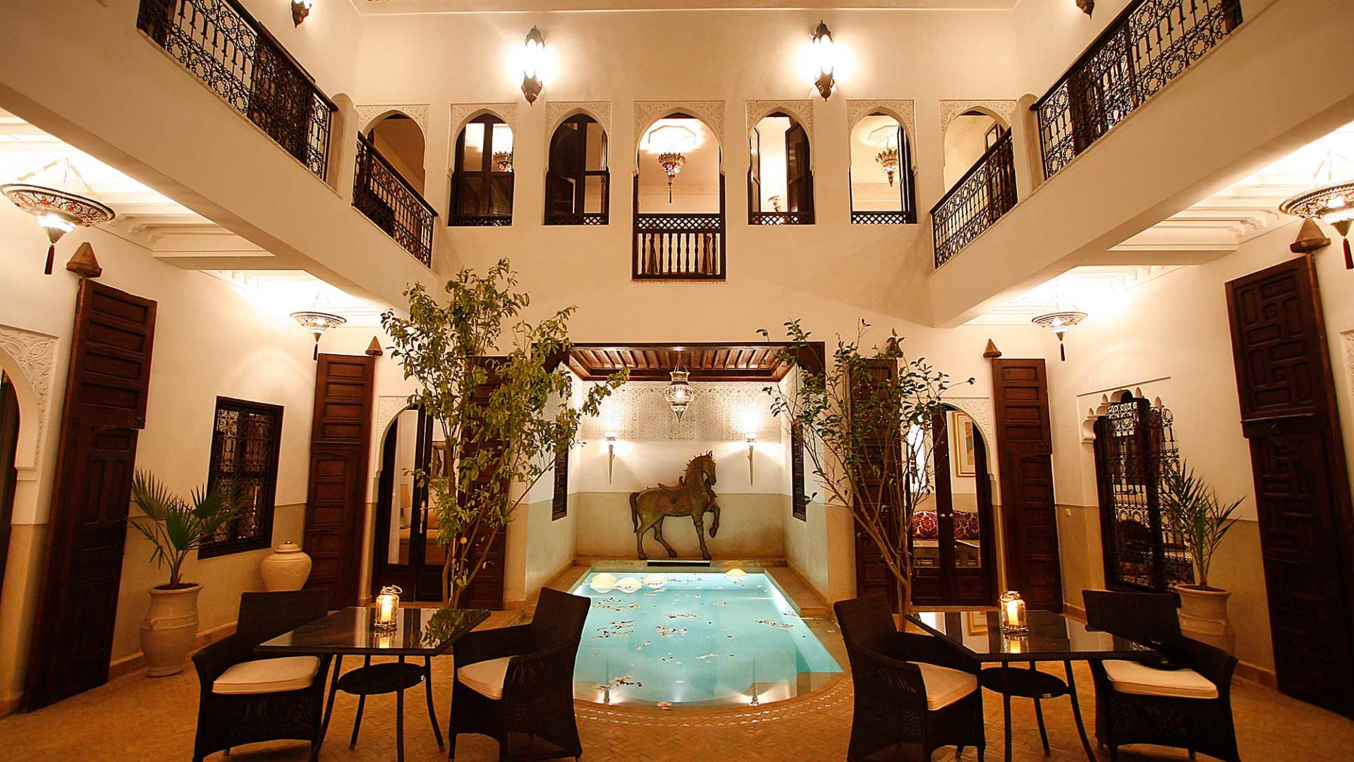 The beautiful courtyard of Riad Assakina at night