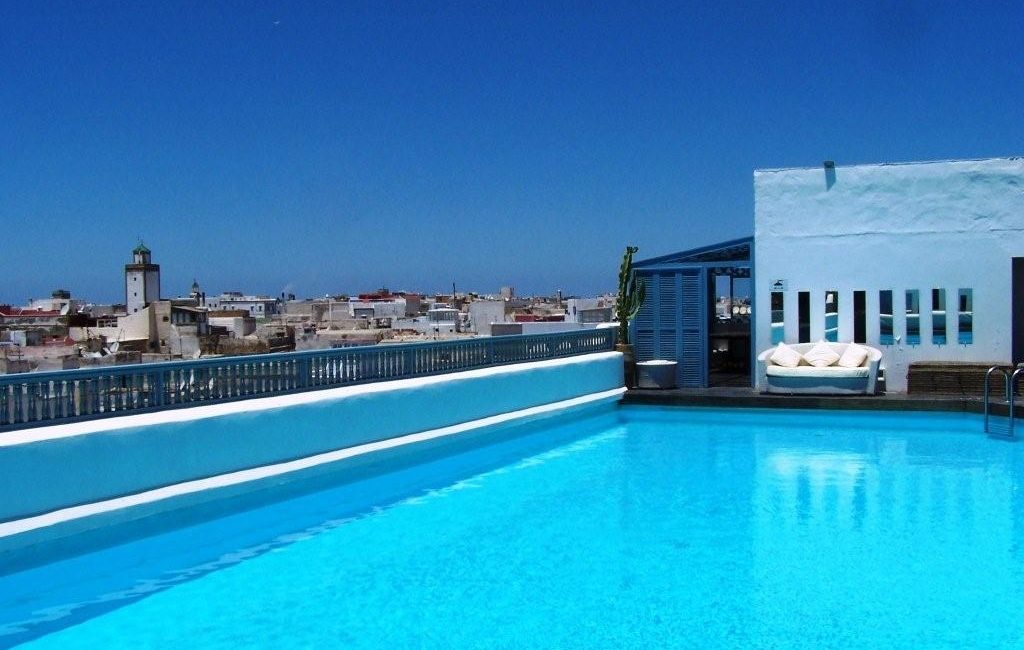 The rooftop pool and terrace at L'Heure Bleue