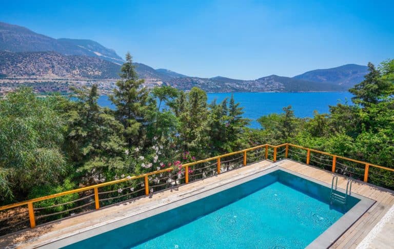 Villa Arycanda, Kalkan – panoramic view over the private swimming pool to the shimmering bay and surrounding hillside villas.