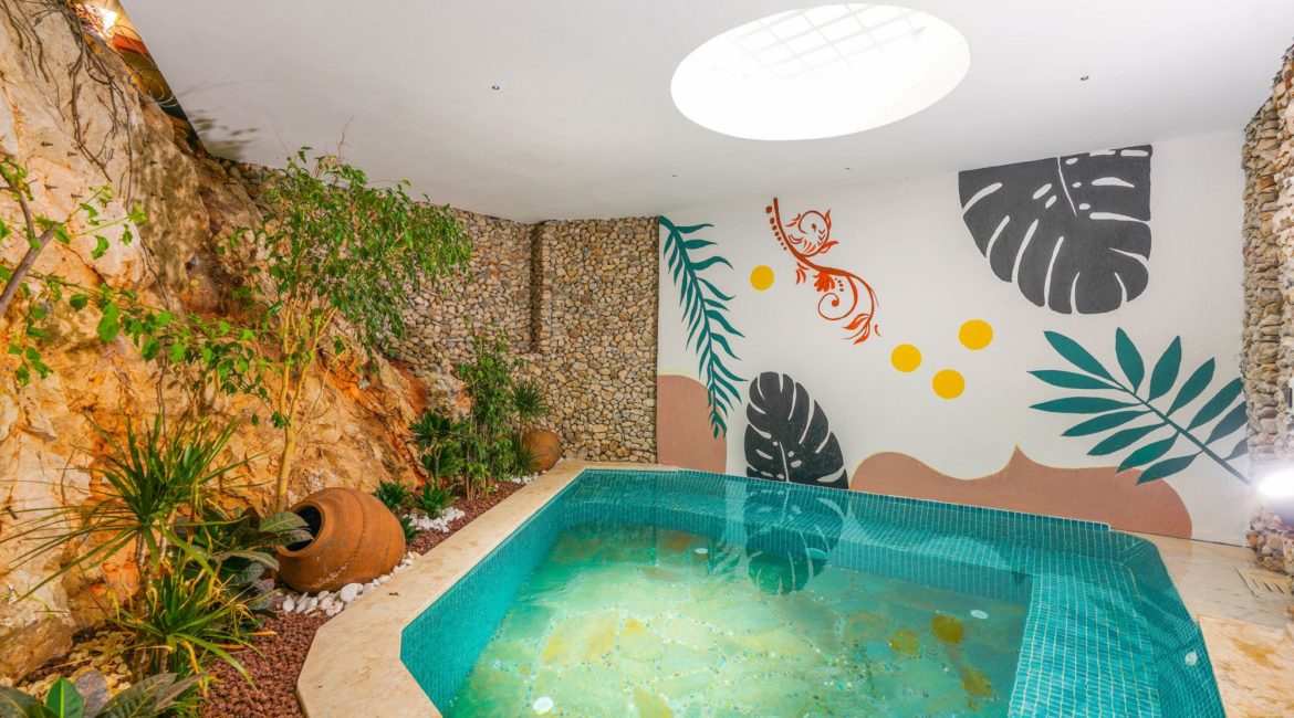 Villa Sidyma Indoor Pool with artwork