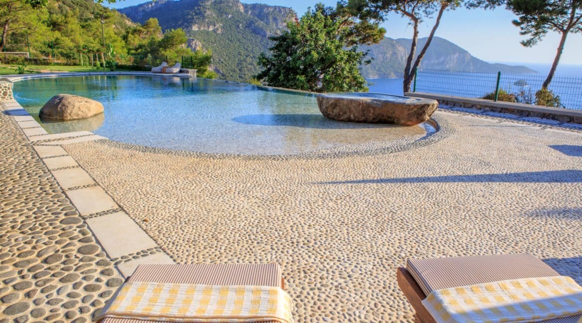 Gokce pebbled infinity pool and glorious mountain and sea views