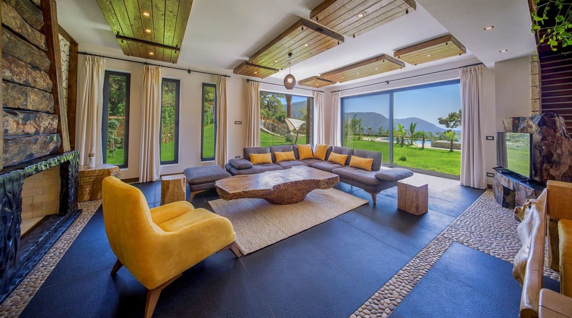Gokce sitting room and windows that imbibe the serene gardens