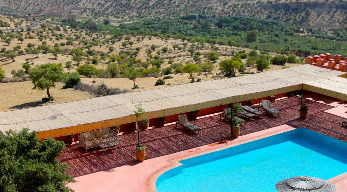 Atlas Kasbah swimming pool encased by undulating terrain