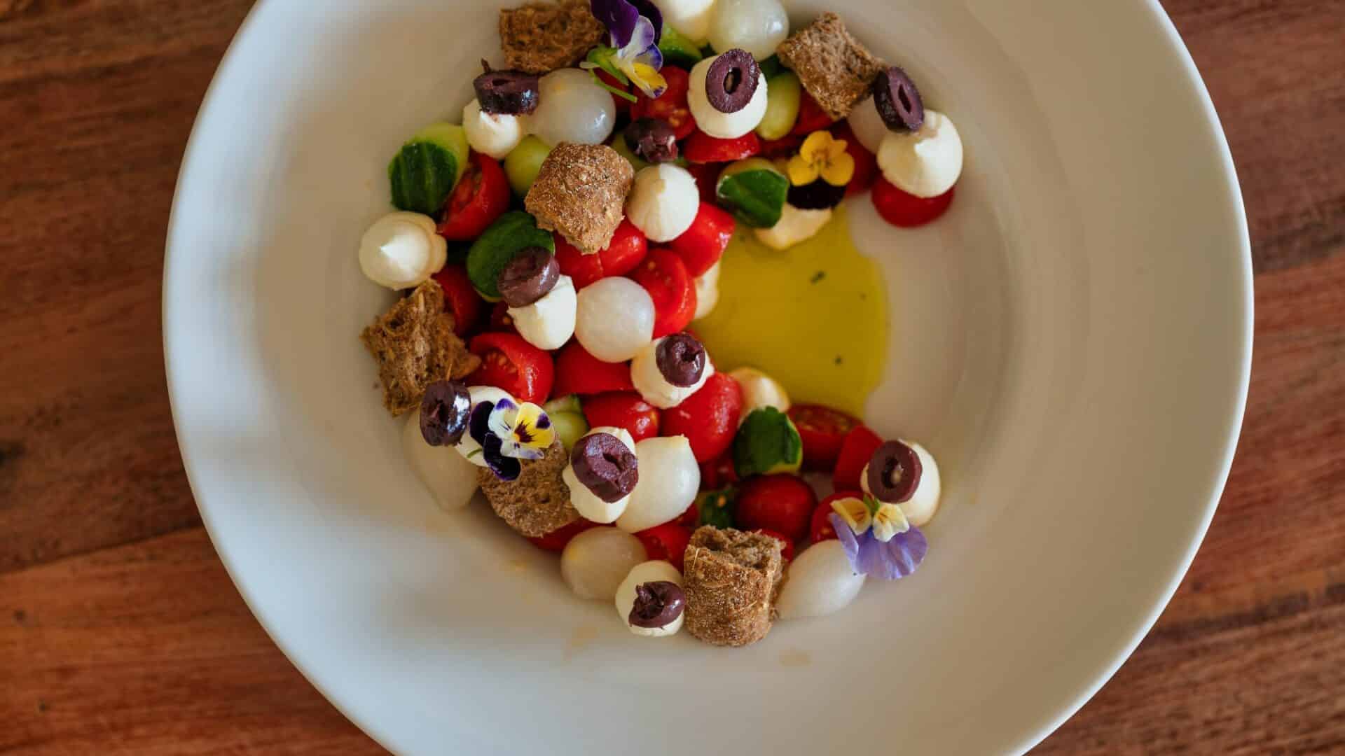 Minos Ambassador Half Board concept tomato and mozzarella salad