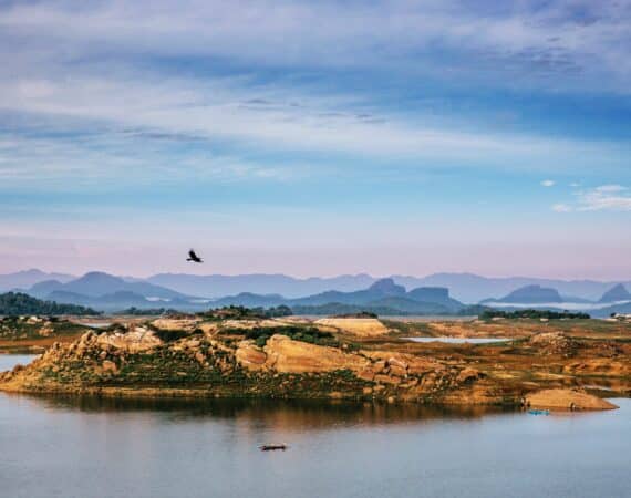 Gal Oya National Park – sweeping landscape views of lush forested hills, shimmering water, and expansive skies.