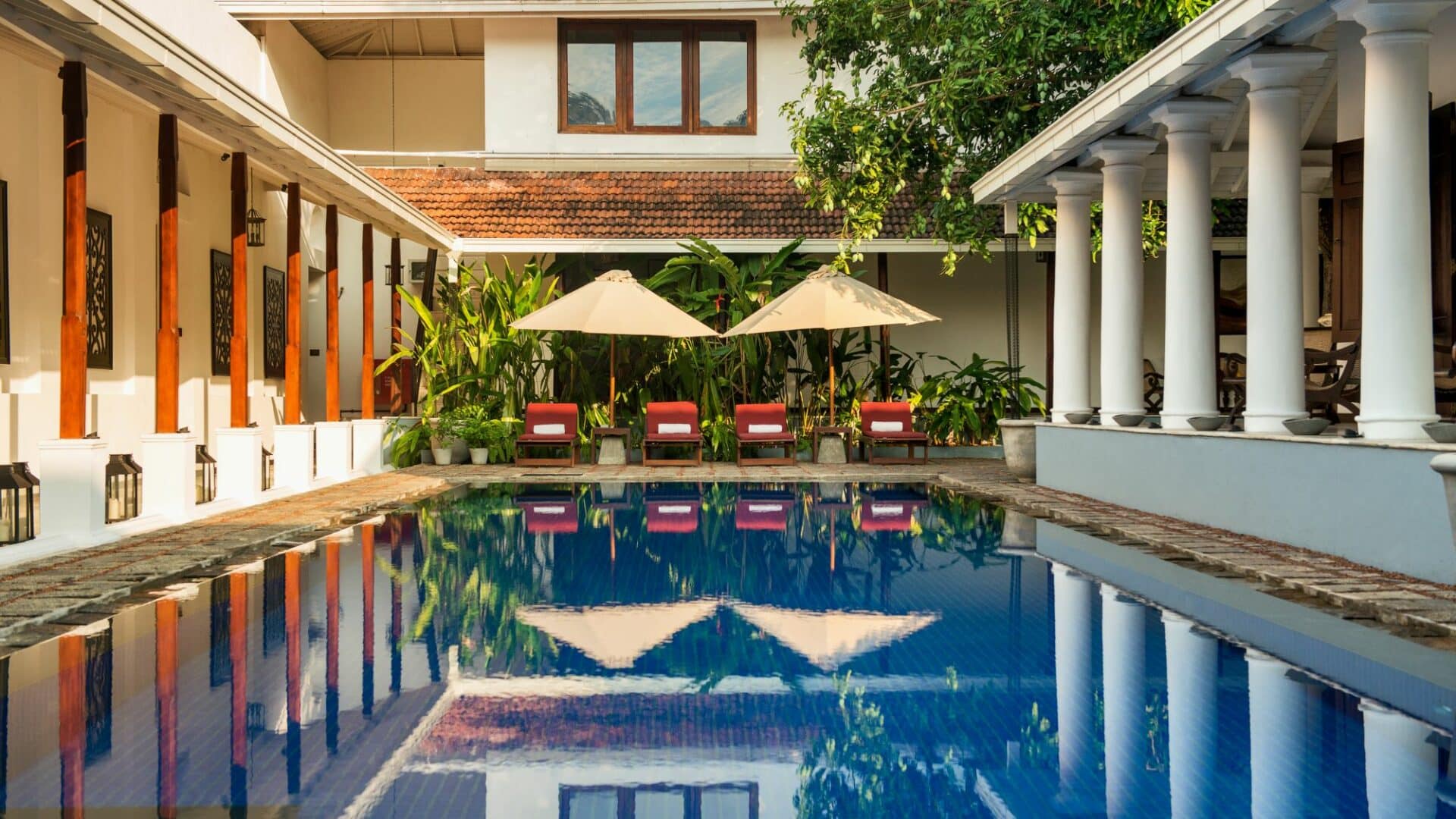 The Residence by day in Colombo, Sri Lanka – tranquil courtyard with swimming pool and day beds, offering peaceful luxury in the heart of the city.