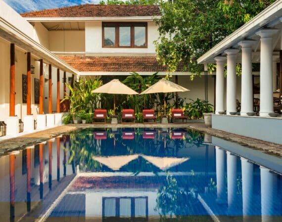 The Residence by day in Colombo, Sri Lanka – tranquil courtyard with swimming pool and day beds, offering peaceful luxury in the heart of the city.