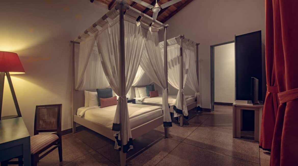 Spacious two-bedroom Family Suite at The Wallawwa with garden views, four-poster king bed, twin room, and private verandah