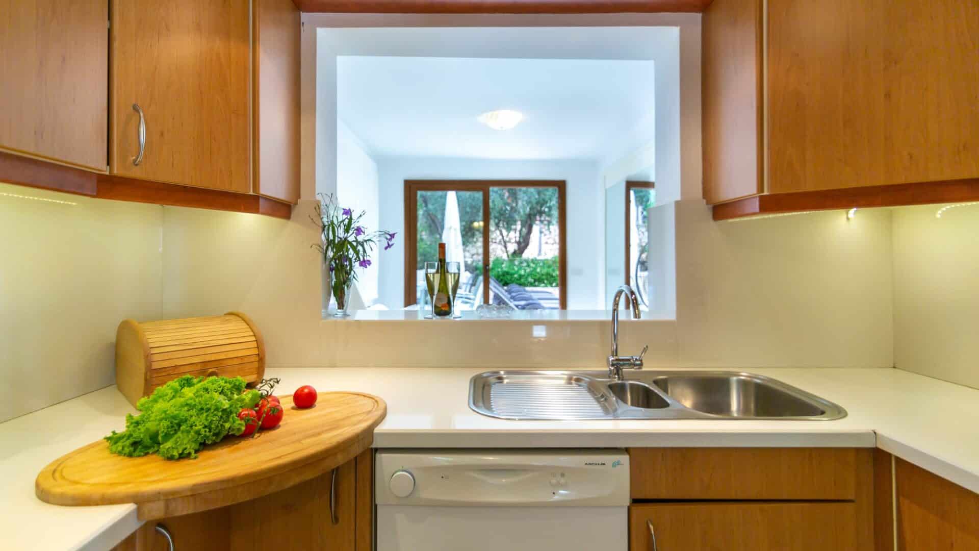 Villa Likya Kalkan kitchen surveying dining room