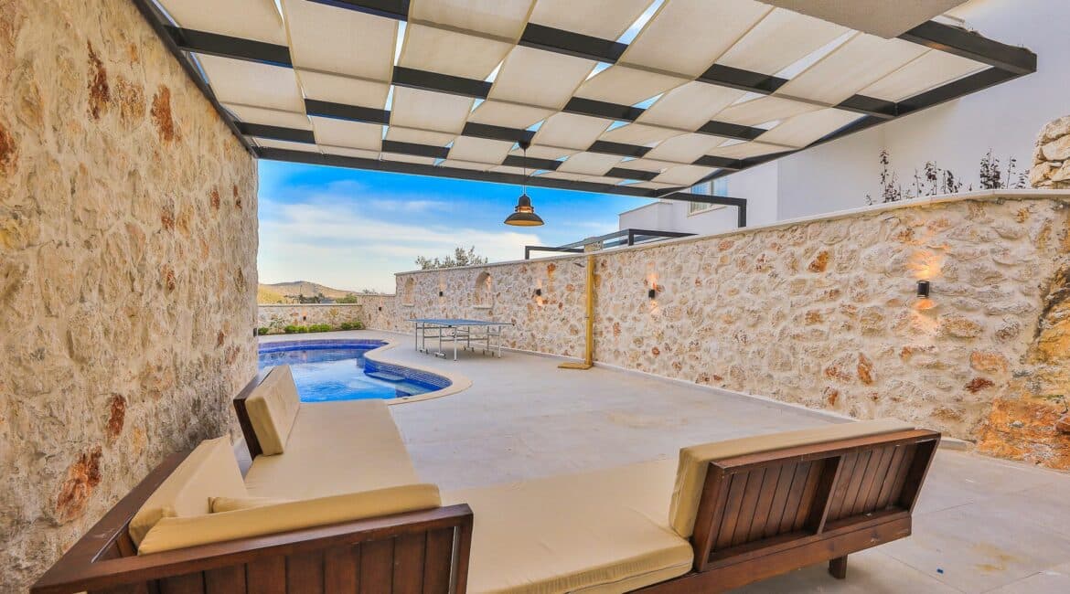 Elif Villas general seating area under the shade of a pergola