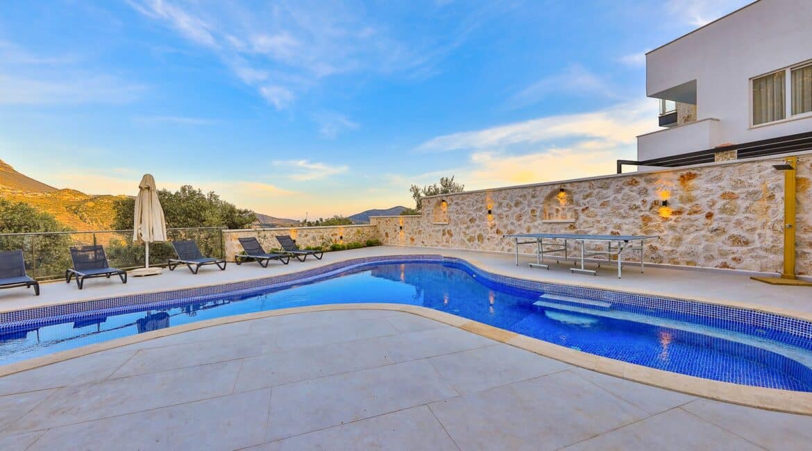 Elif Villas general seating swimming pool at sunset