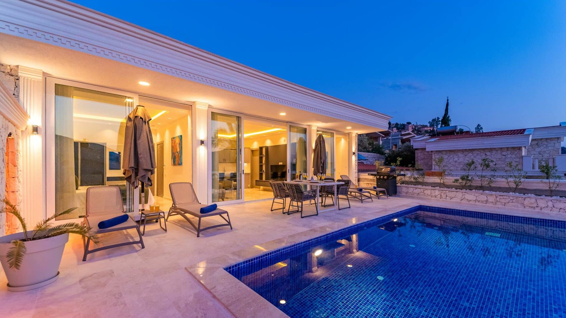 Villa Bahce Kalkan swimming pool and surrounding terraces at dusk