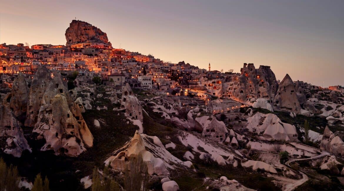 Argos in Cappadocia and Uchisar castle backdrop as dusk falls