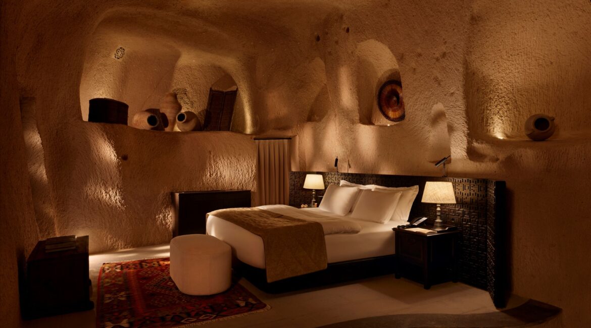 Argos in Cappadocia beautiful bedroom in a cave suite with traditional artefacts