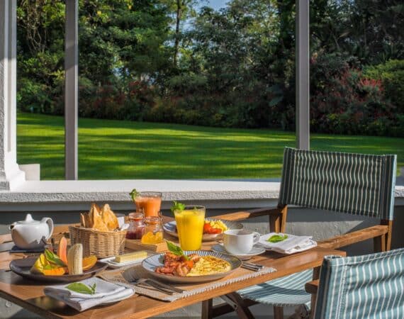 Breakfast served beside the manicured lawns at Nine Skies bungalow in Sri Lanka’s Hill Country