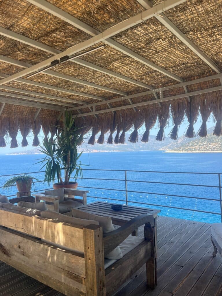 Zest Beach Club entrance in Kalkan with elegant seating area, panoramic sea views and clear blue skies on Turkey’s Turquoise Coast.