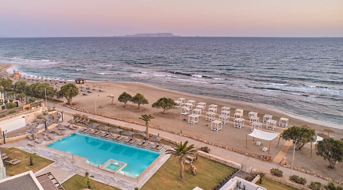 Paralos Kosta Alimia Beach Crete and swimming pool with sea views at dusk