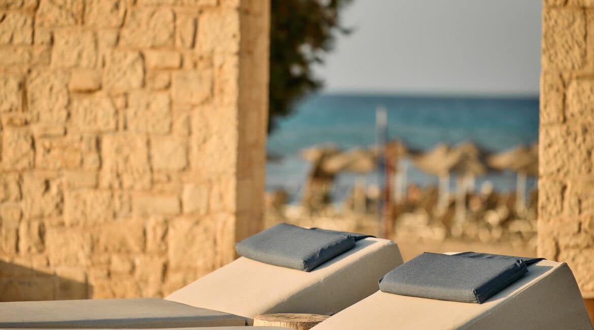 Paralos Kosta Alimia Crete sun drenched day beds by the beach