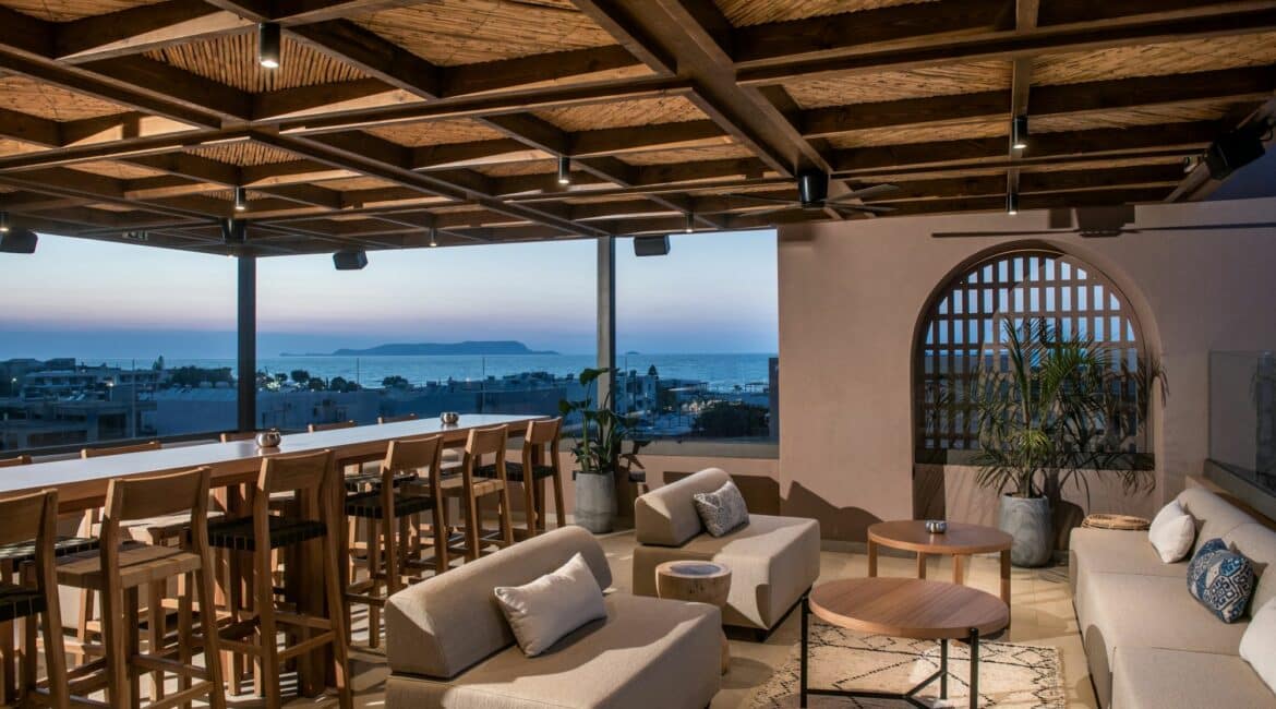 Paralos Venus Suites Crete bar and roof terrace by night