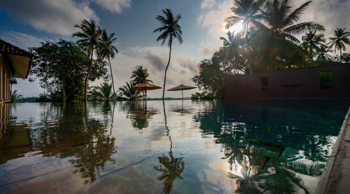 Kahanda Kanda stunning swimming pool and palm tree reflections