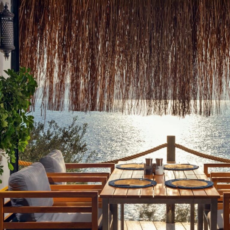 Sophisticated dining terrace at Hotel Villa Mahal, Kalkan, with shimmering sea views like a thousand splendid suns