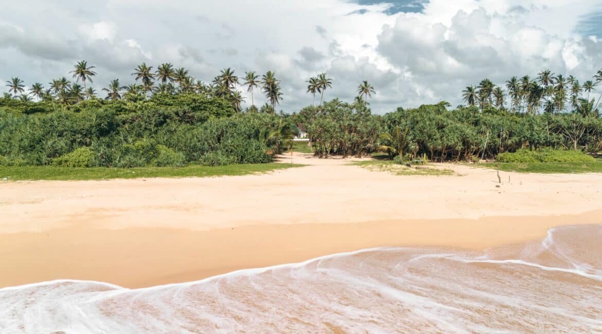 Golden sands of Bentota Beach near The Villa Bentota, just moments from the shoreline.