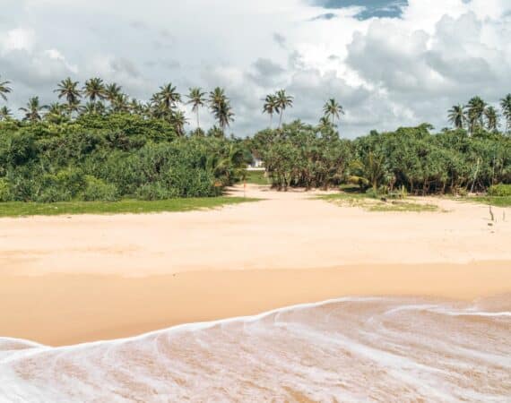 Golden sands of Bentota Beach near The Villa Bentota, just moments from the shoreline.