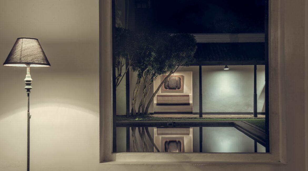 The Villa Bentota swimming pool by night views from the inside- out