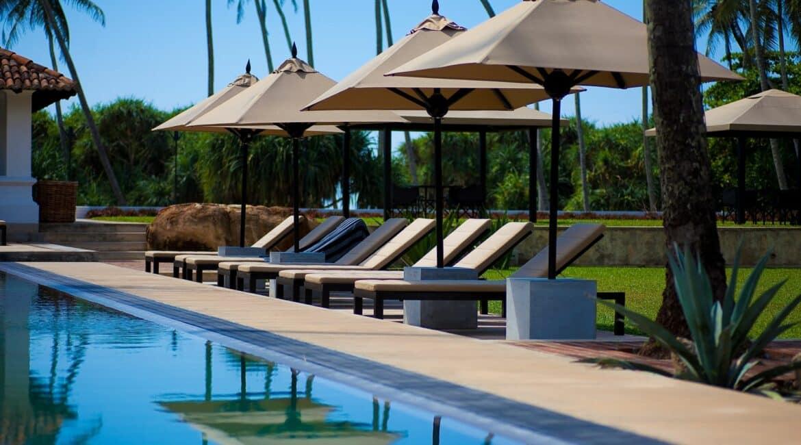 The Villa Bentota swimming pool fringed by lawns