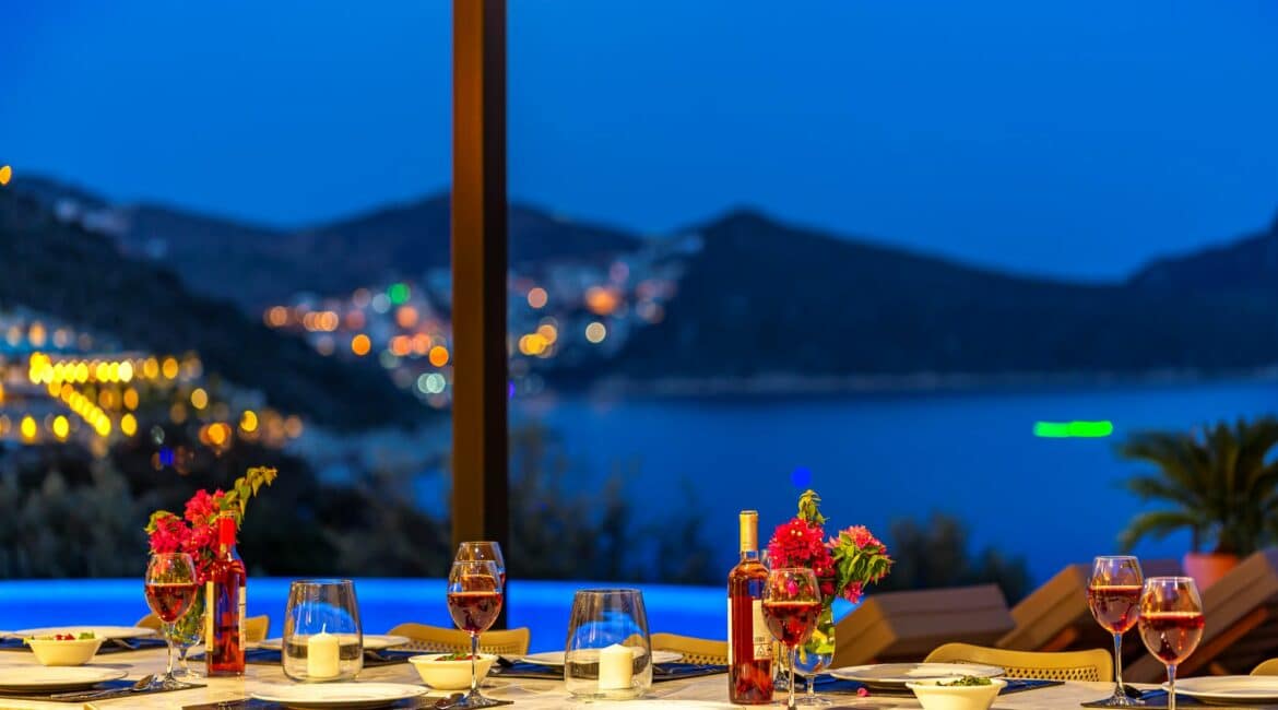 Villa Guney Exclusive 5 bedroom villa Kalamar Bay stunning alfresco dining setting at night