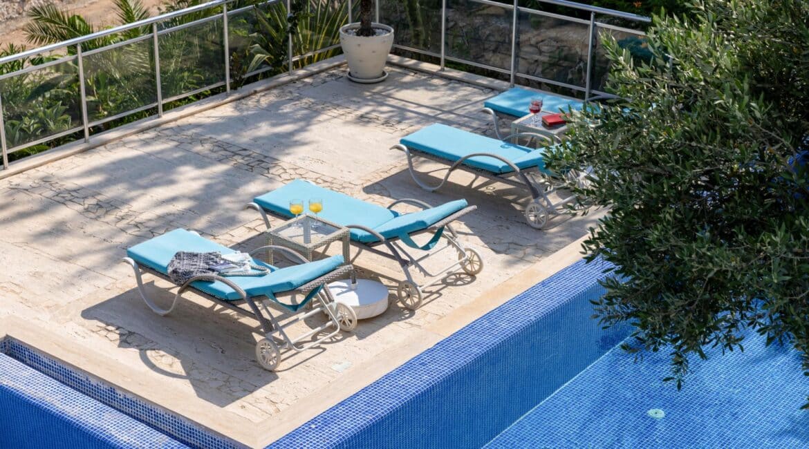 Villa Oasis Kalkan stunning views over the swimming pool surrounded by foilage