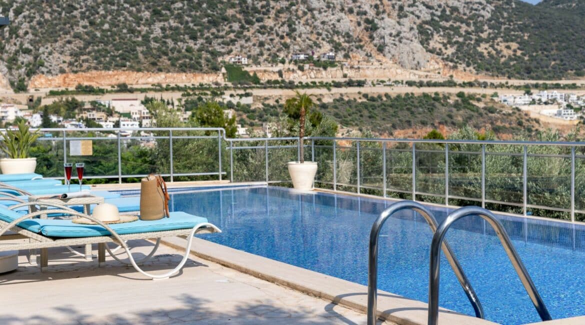 Villa Oasis Kalkan swimming pool against a rocky mountain backdrop