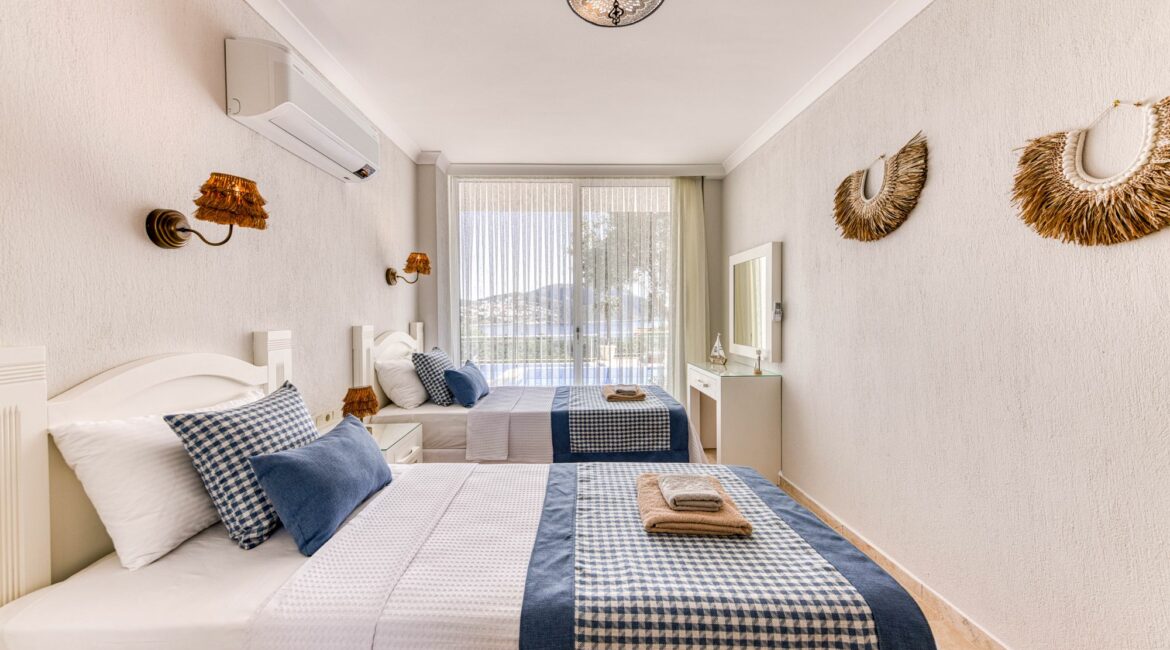 Villa Oasis Kalkan twin bedroom opening onto the pool terrace