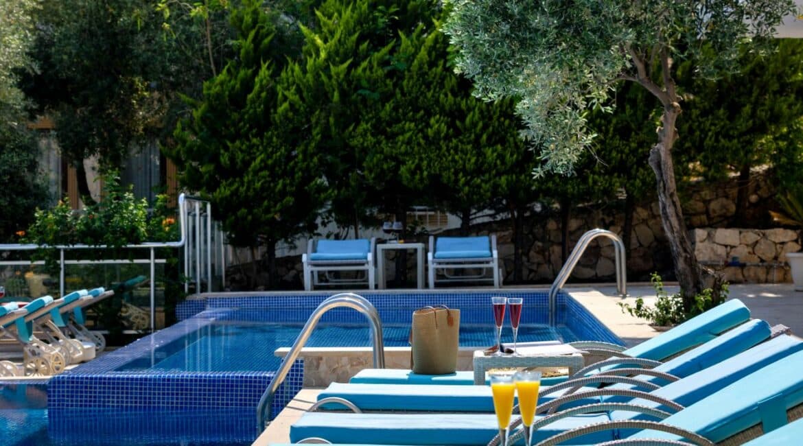 Villa Oasis glorious swimming pools fringed by comfy day beds