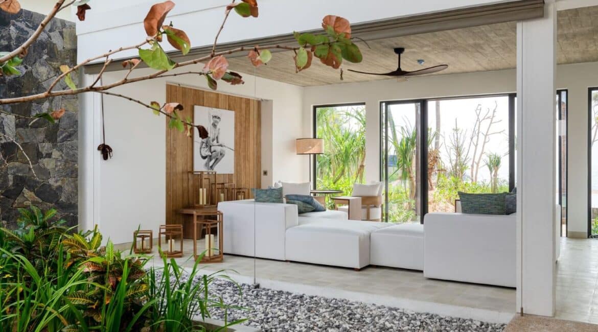 Bay View Suite at Ahu Bay Sri Lanka featuring an alfresco area with a timber deck, outdoor seating, and views of the garden and ocean.