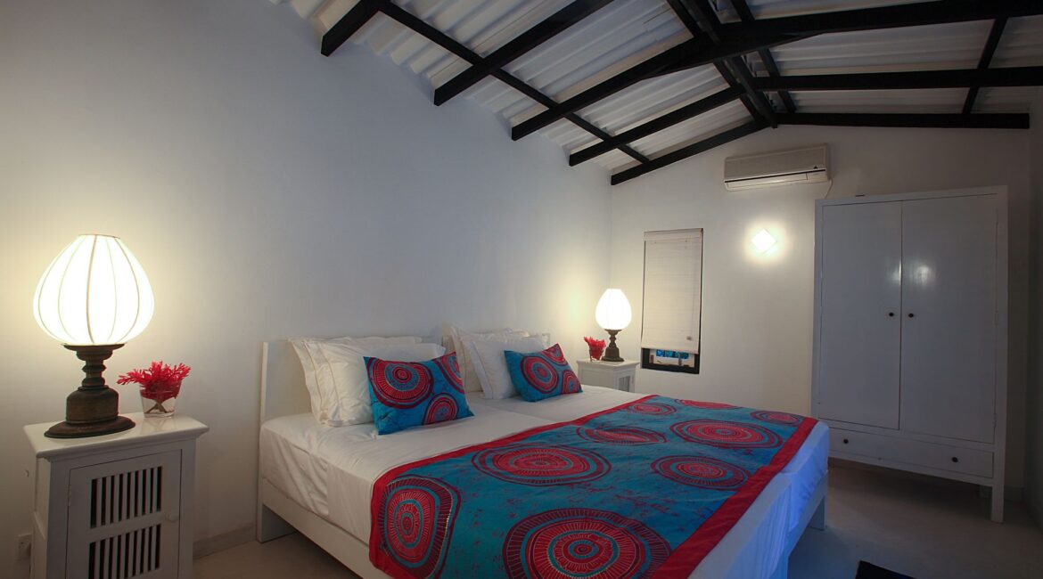 Arica Bedroom at Coco Tangalla near Tangalle, Sri Lanka – brightly coloured twin room with vibrant textiles, en-suite bathroom, and interconnecting option with King Coco