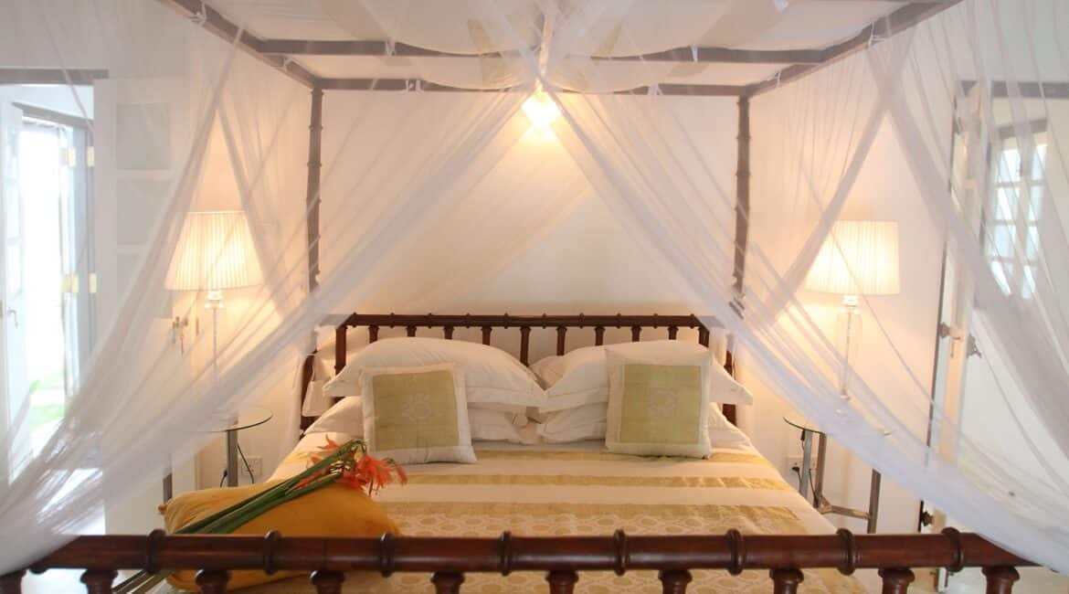 King Coco Bedroom at Coco Tangalla near Tangalle, Sri Lanka – elegant double room with four-poster king-sized bed and spacious en-suite bathroom.