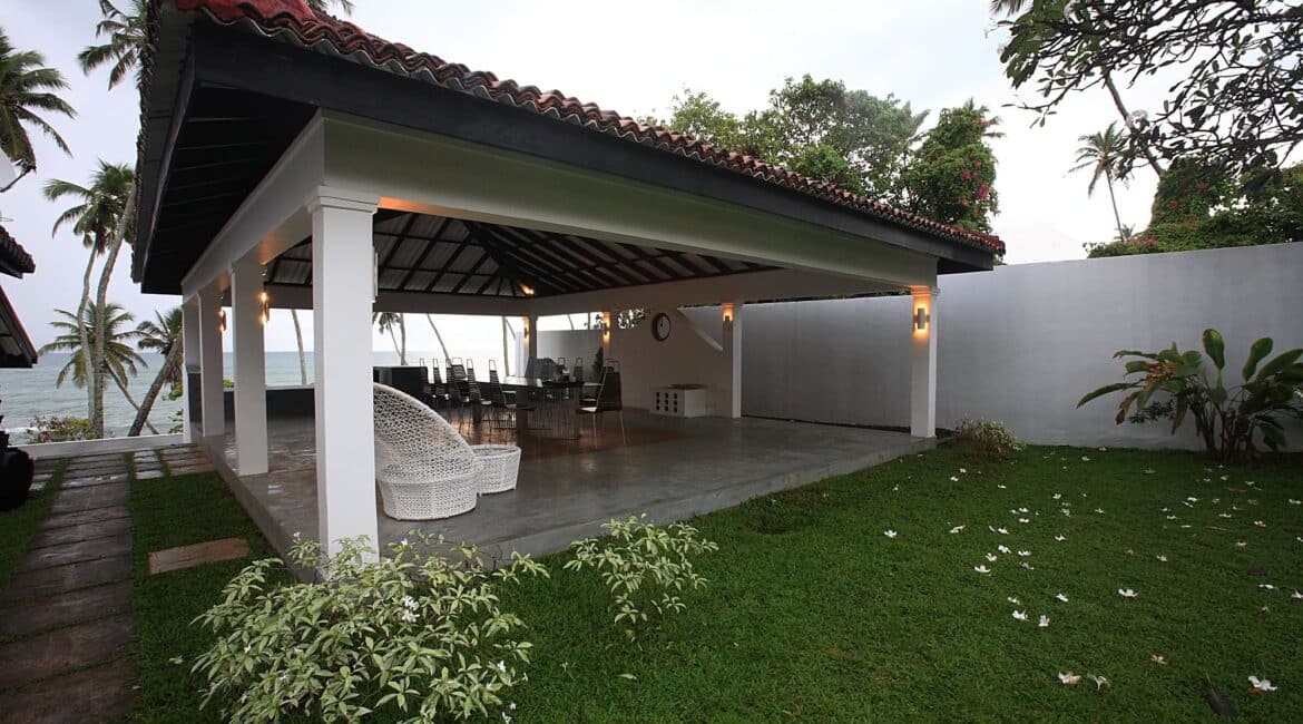 Sea-facing Ambalama pavilion in the garden at Coco Tangalla near Tangalle, Sri Lanka – open-air lounge with panoramic Indian Ocean views