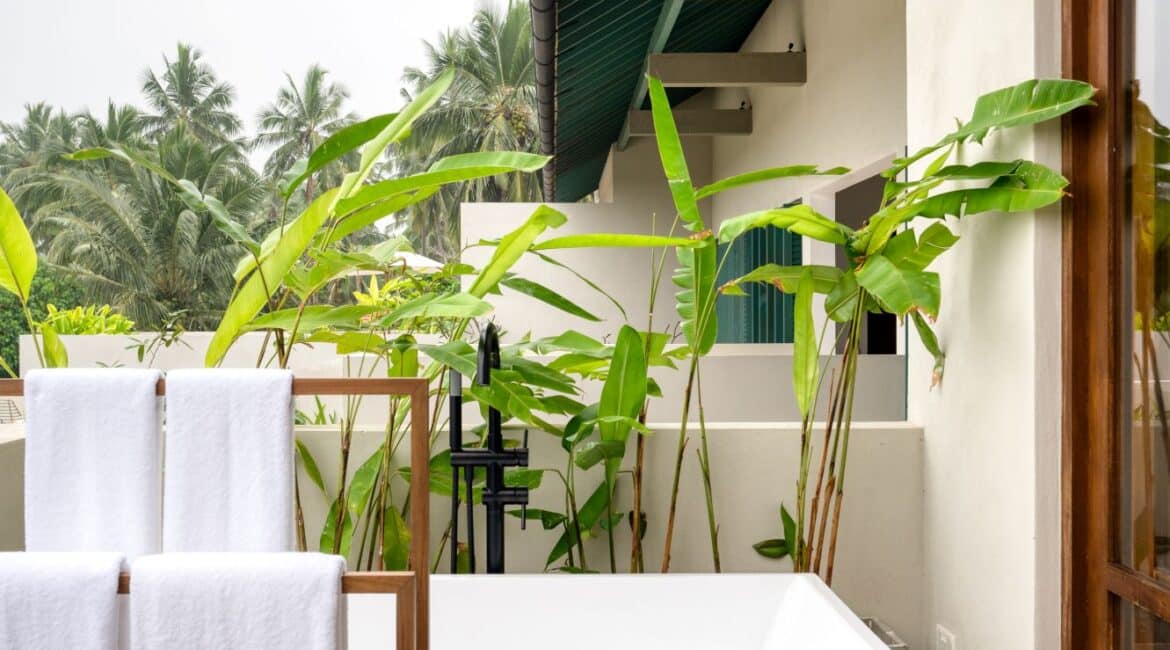 Kayaam House Sri Lanka – Palm View Room with a freestanding bathtub on the private terrace, offering serene views and a tranquil outdoor bathing experience.