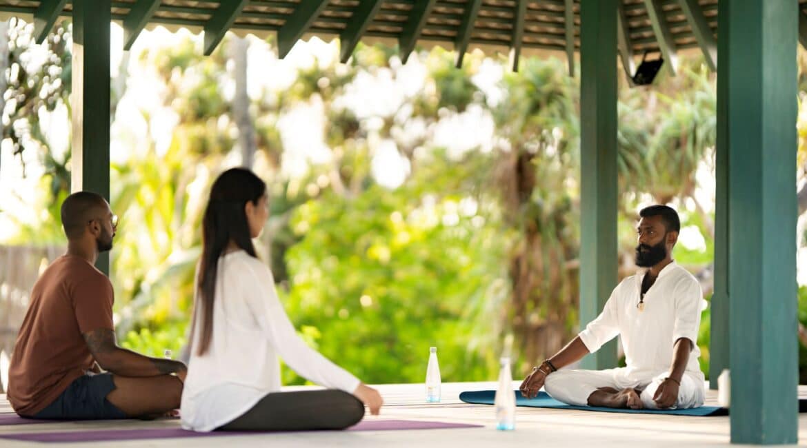 Kayaam House Sri Lanka – open-air Yoga Pavilion facing the beach, surrounded by palm trees and coastal serenity.