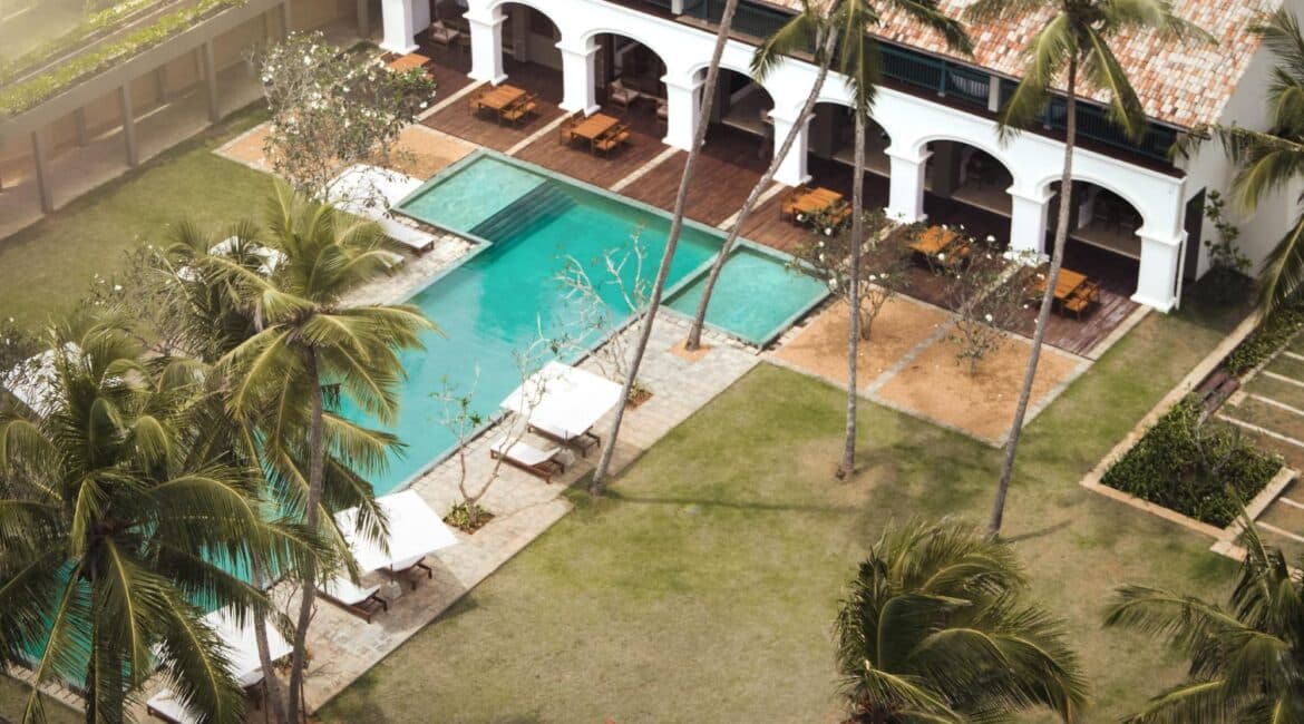 Kayaam House Sri Lanka – aerial view of the hotel and ocean-facing swimming pool, surrounded by tropical gardens and overlooking the south coast.