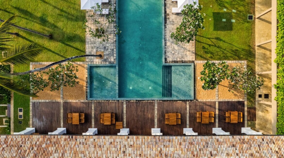 Kayaam House Sri Lanka – aerial view showcasing the hotel grounds, manicured gardens, and inviting swimming pool near the Indian Ocean.