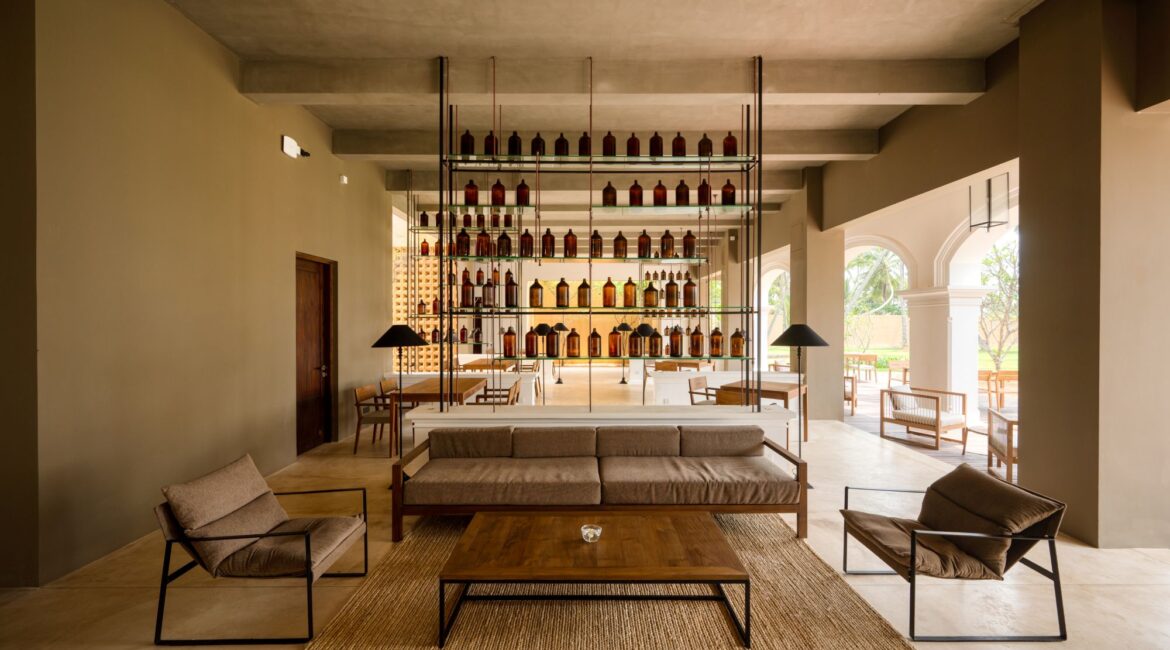 Kayaam House Sri Lanka – communal lounge and sitting area opening onto a sweeping veranda with views across manicured lawns.