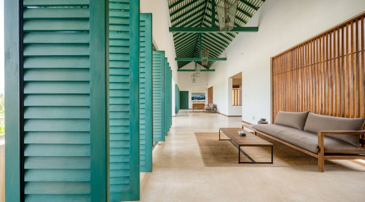 Kayaam House Sri Lanka – elegant sitting area on the veranda with plush furnishings and views of the tropical garden.