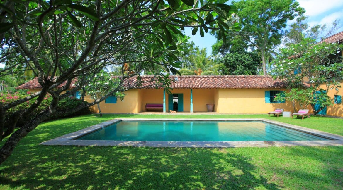 The Last House Tangalle Sri Lanka sun dappled lawns and swimming pool