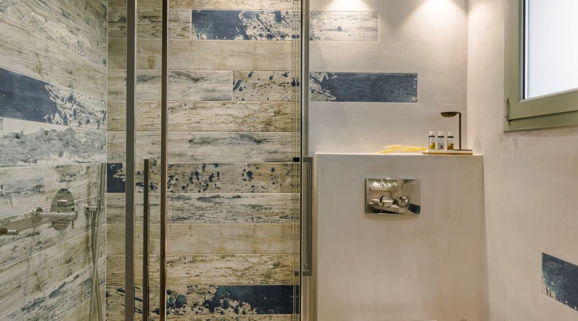 Contemporary family bathroom with walk-in shower at Villa Nikolis, Braunis Horio, Assos, Kefalonia.