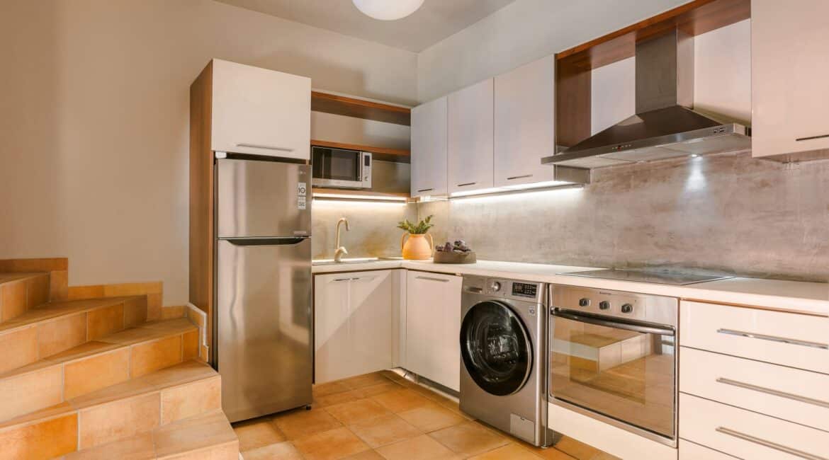 Fully equipped modern kitchen with dining area at Villa Nikolis, Braunis Horio, Assos, Kefalonia