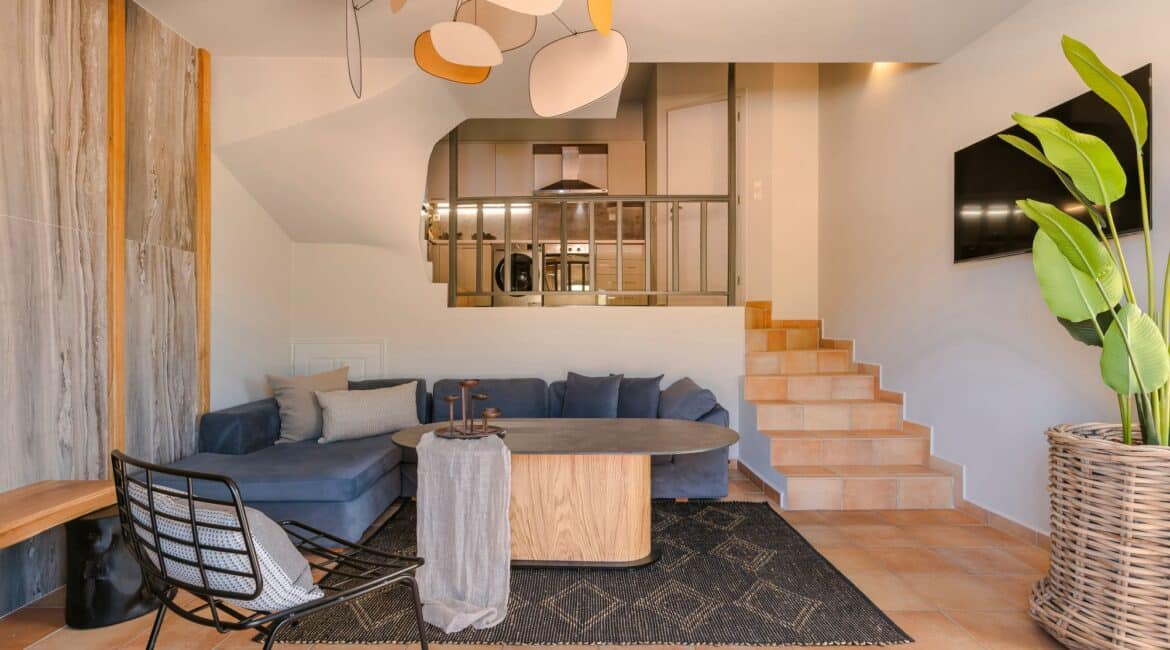 Stylish kitchen and living space with stone accents at Villa Nikolis, Braunis Horio, Assos, Kefalonia.