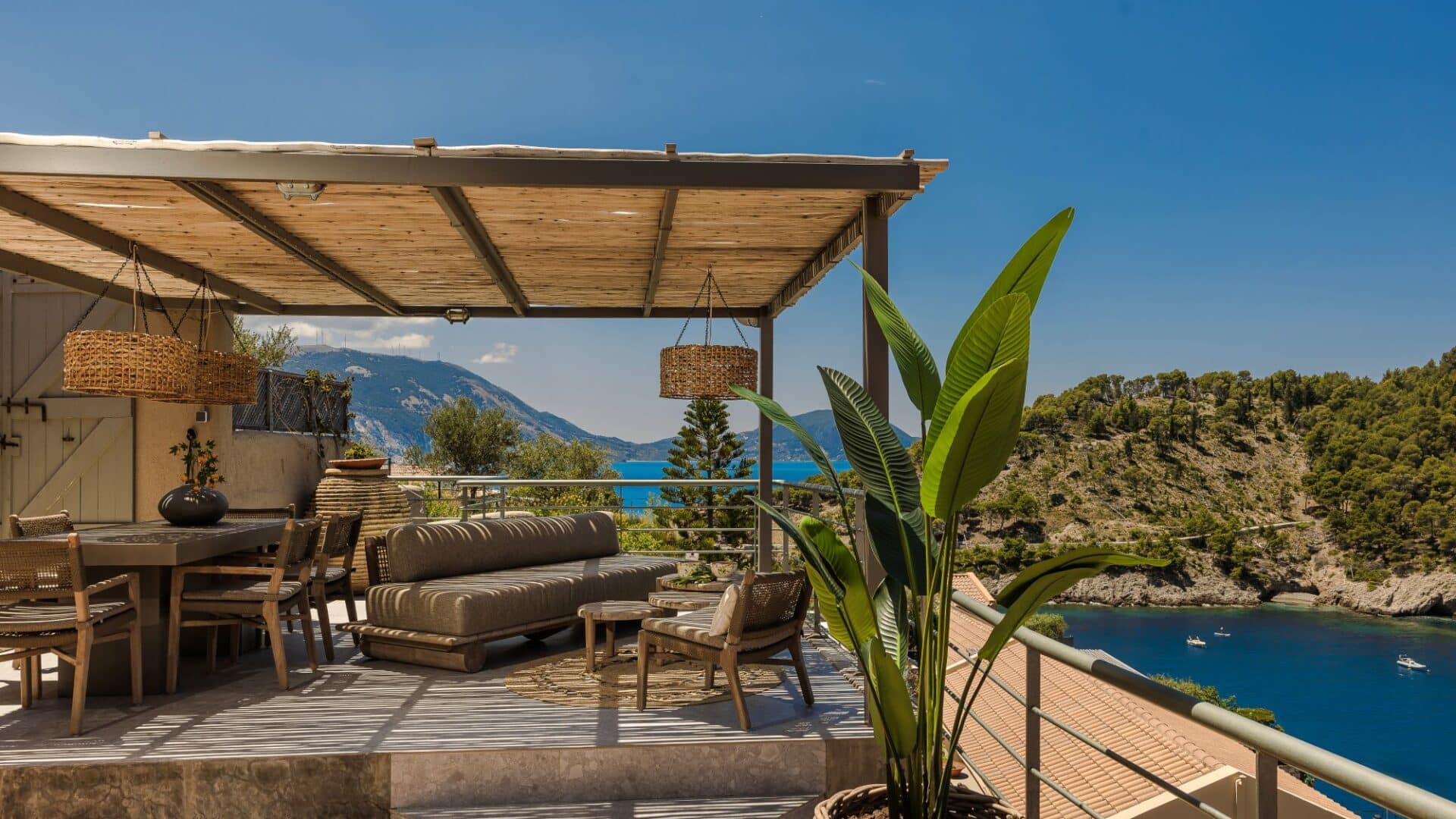 Balcony view of the Assos isthmus and turquoise Ionian waters from Villa Nikolis, Braunis Horio, Assos, Kefalonia.