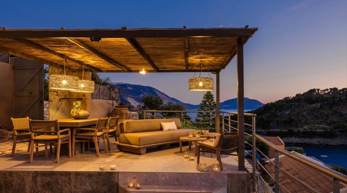 Outdoor stone steps leading to alfresco dining area and sitting area at Villa Nikolis, Braunis Horio, Assos, Kefalonia.